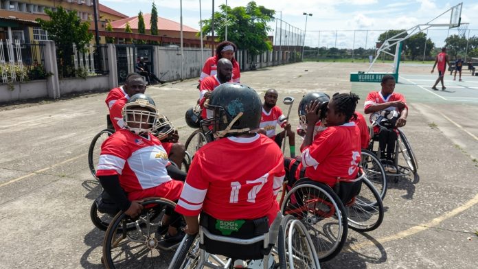 Liberty Pioneer vence a primeira Exposição de Futebol Americano em Cadeira de Rodas, no Instituto Nacional de Desportos (NIS), Estádio Nacional, Lagos, Nigéria (Foto: Divulgação AFEDEV) Liberty Pioneer vence a primeira Exposição de Futebol Americano em Cadeira de Rodas, no Instituto Nacional de Desportos (NIS), Estádio Nacional, Lagos, Nigéria (Foto: Divulgação AFEDEV)