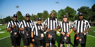 Equipe de arbitragem com kit personalizado do Programa de Desenvolvimento de Árbitros (Foto: David Dermer)